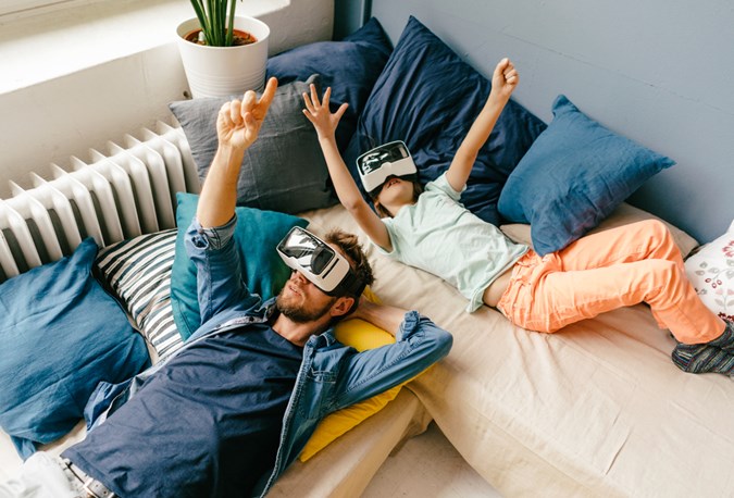 Awww father-son bonding via virtual reality. The cheats way to swim with sharks and walk with dinosaurs.