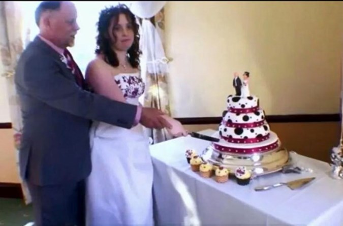 David and Sarah cut the cake.