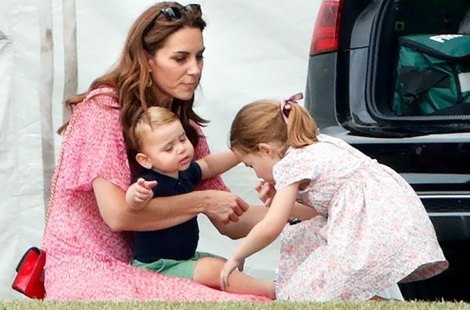 While engaging with one the tiny tots, the Duchess was seemingly reminded of her youngest child, Prince Louis, one, who hinted is going through a particularly clingy phase. Image: Getty