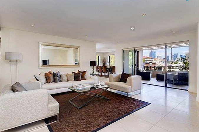 Spacious luxury living room at the Potts Point property. Image: Domain